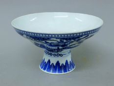 A Chinese blue and white porcelain tazza decorated with calligraphy. 19 cm diameter.