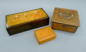 A wooden box, the lid with Dutch scene and two other boxes. The former 35 cm wide.