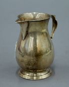 A silver cream jug. 8.5 cm high. 124.2 grammes.