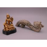 A jade dragon belt hook and a small gilt Buddha figure. The former 11 cm high.