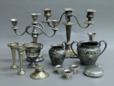 A small box of silver plated items.