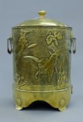 An Arts & Crafts brass coal bin. 48 cm high.