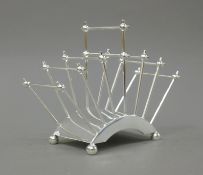 A Christopher Dresser style silver plated toast rack.