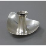 A Modernist silver candlestick.