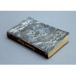 A 19th century miniature book of Common Prayer, with silver hallmarked cover. 9.5 cm high.