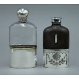 A silver topped cut glass spirit flask,