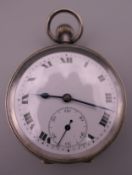 A silver pocket watch. 4.5 cm diameter.