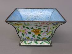 A Chinese square enamel bowl. 13.5 cm wide.