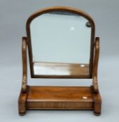 A Victorian mahogany toilet mirror. 54 cm wide.