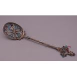 An unmarked silver filigree plique a jour spoon. 16.5 cm long.