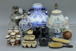A quantity of miscellaneous items, including lamps, binoculars,
