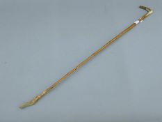 A riding crop. 71 cm long.