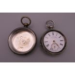 A silver pocket watch and a plated pocket watch case. The former 5 cm diameter.