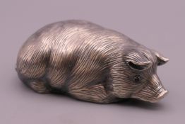 A silver model of a pig, bearing Russian marks. 6 cm long.