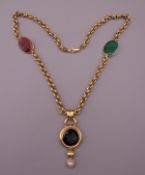 A 14 K gold intaglio set necklace. 41 cm long. 20.3 grammes total weight.