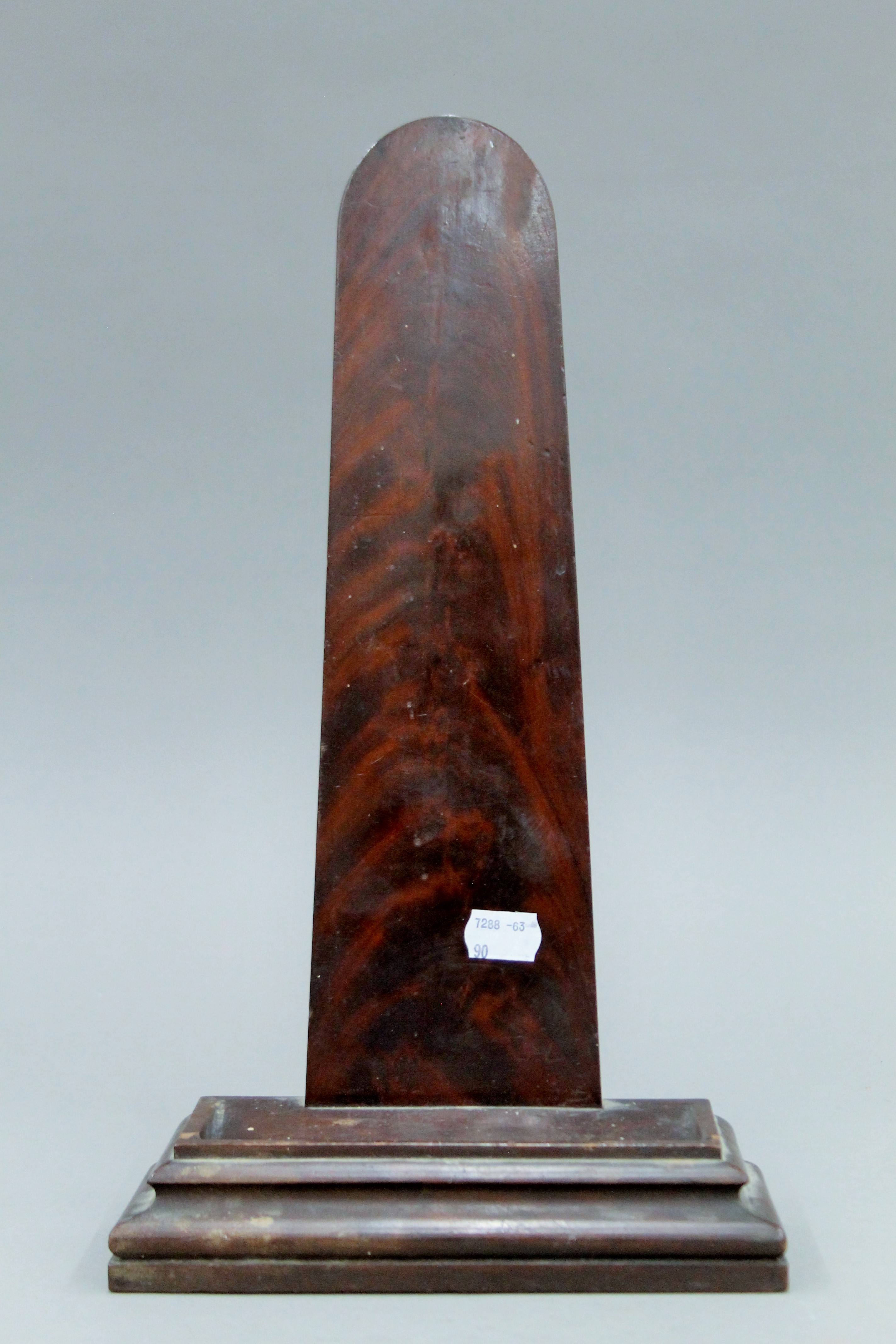 A 19th century mahogany plate stand, with lead weighted moulded base. 38 cm high.