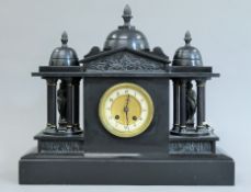 A Victorian black slate mantle clock. 48.5 cm wide.