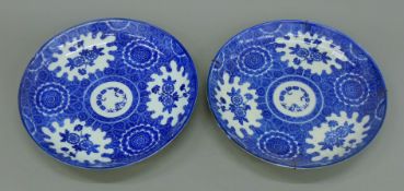 A pair of Japanese blue and white porcelain dishes. 35 cm diameter.