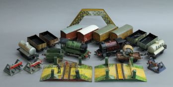 A quantity of various tin plate Hornby locomotives, rolling stock, accessories and track.