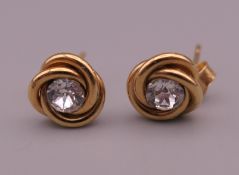 A pair of 9 ct gold earrings. 7 mm wide. 0.7 grammes total weight.