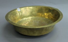 A 19th century brass bowl. 41.5 cm diameter.