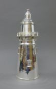 A silver plated lighthouse form cocktail shaker. 36 cm high.