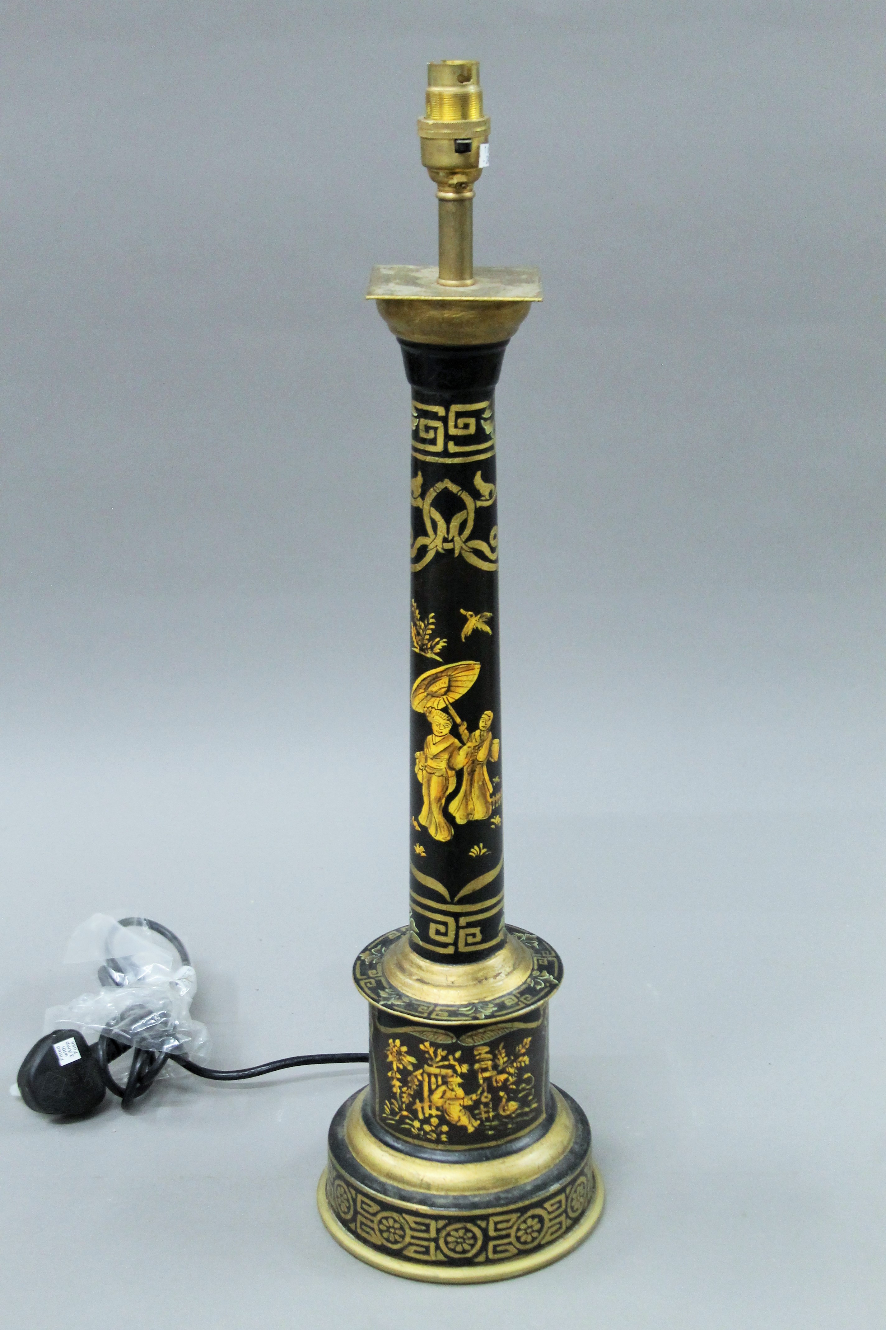 A black toleware column lamp. 61 cm high.