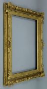 A Victorian gilt picture frame decorated with foliage. 65 x 53 cm exterior dimensions. 49 x 36.