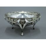 An Art Nouveau silver three footed dish, hallmarked for Birmingham 1913. 9.5 cm diameter. 82.