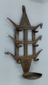 An antique iron bastar tribal toran oil lamp. 52 cm high.