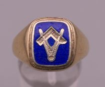 A 9 ct gold blue enamel Masonic signet ring. Ring size Q. 8.4 grammes total weight.