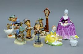 Two Doulton figurines and five Hummel figurines.