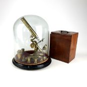 A brass bound Carpenter and Wesley microscope with original finish,