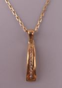 A 9 ct gold diamond set pendant on a 9 ct gold chain. The pendant 2 cm high. 3.