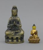 A small gilt bronze Buddha and a larger brass Buddha, marks to base. Former 8.