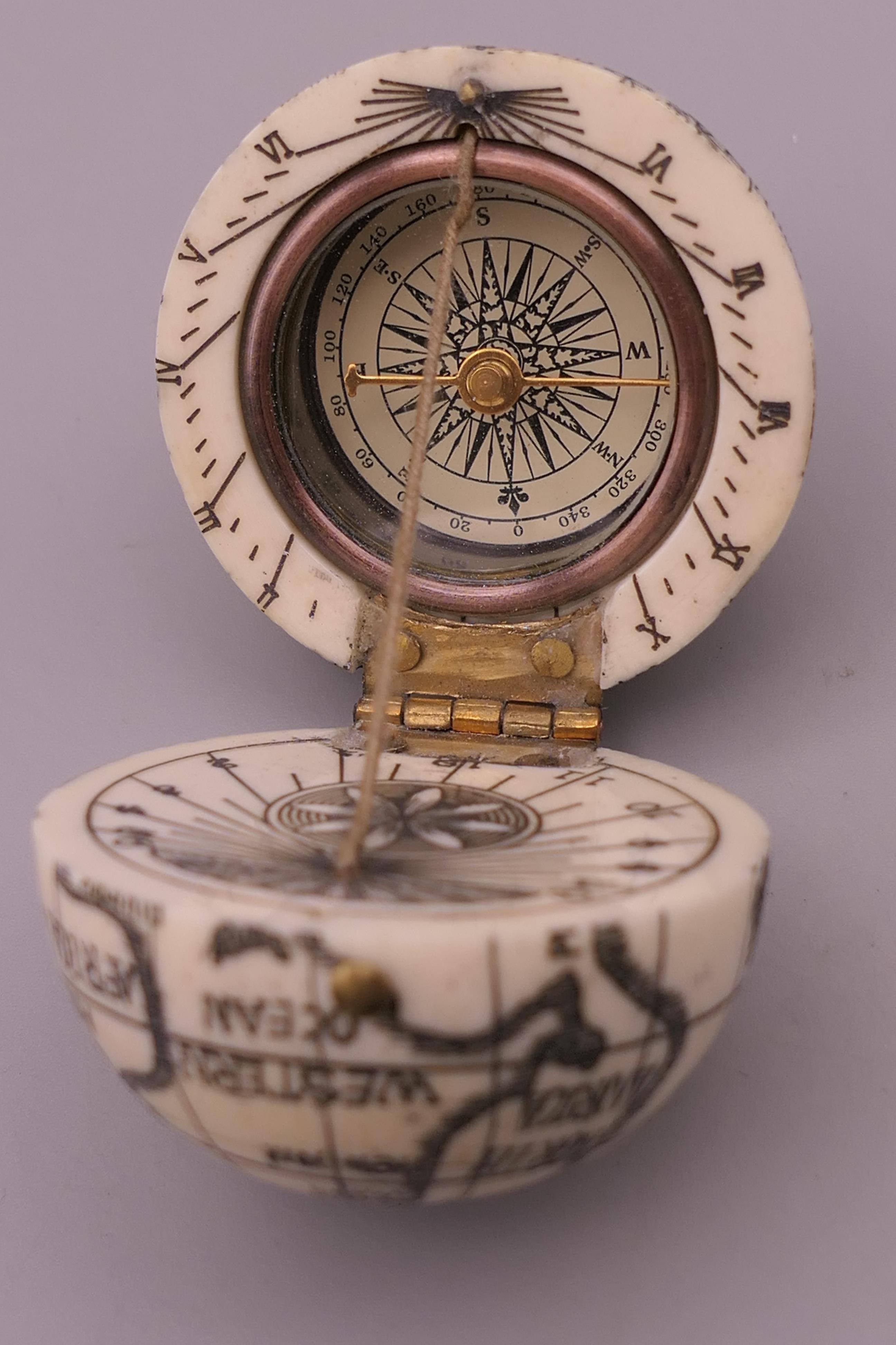 A bone globe compass. 4 cm high. - Image 2 of 3