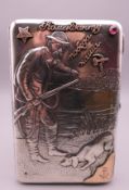 A Russian silver cigarette case depicting a hunting man and a dog. 8 cm wide. 191.