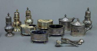 A cased silver cruet set.