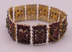 A Bohemian garnet set bracelet. 18 cm long.