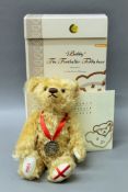 A boxed Steiff Bobby the Footballer teddy bear.