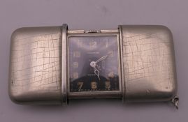 A Movado purse watch. 5 cm wide.