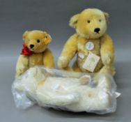 Three unboxed Steiff teddy bears.