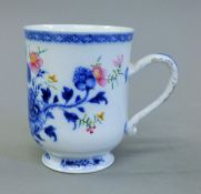 A Chinese Export porcelain tankard. 11 cm high.