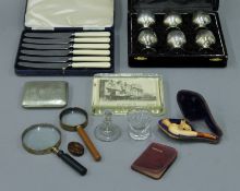 A quantity of miscellaneous items, including silver plate, a pipe, a magnifying glass, etc.