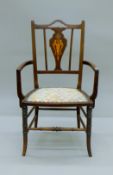 An Edwardian mahogany open armchair. 51 cm wide.