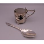 A silver jam spoon and an Art Nouveau silver mustard pot. The latter 6.5 cm high.