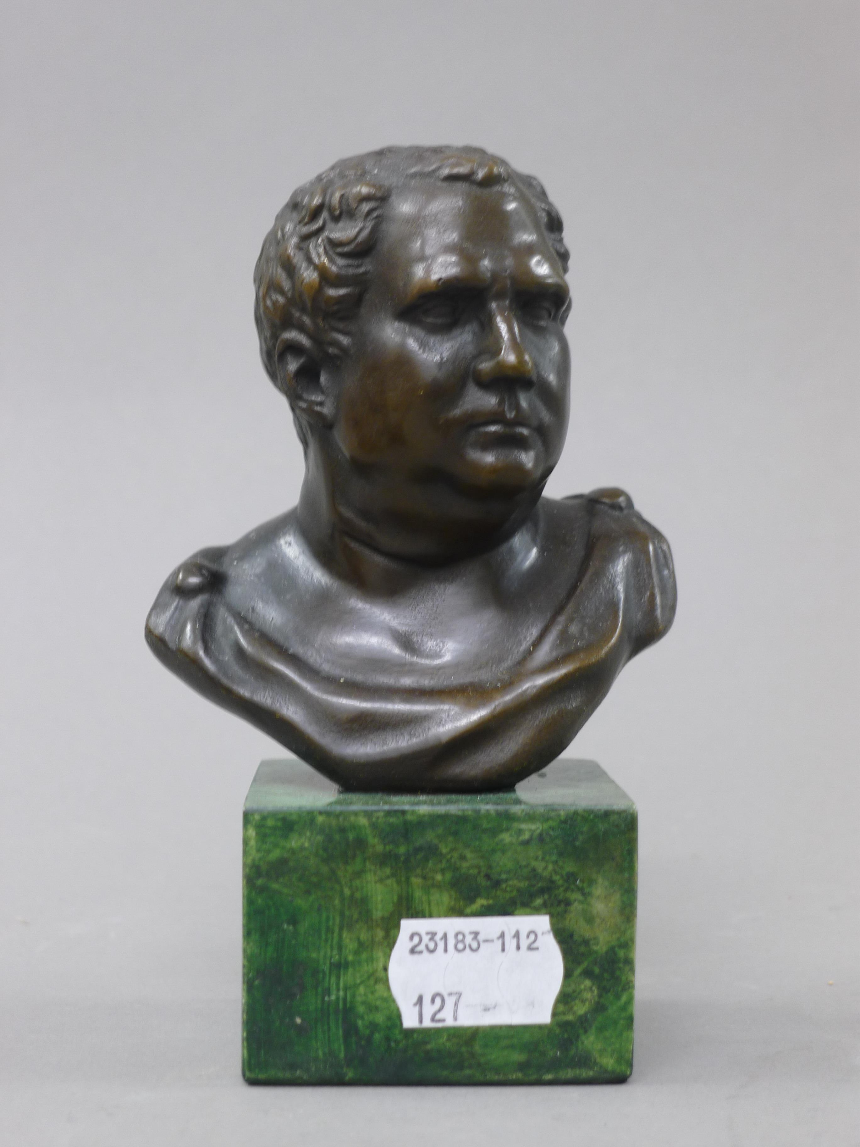 A small bronze bust on a marble plinth. 14 cm high.