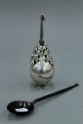 An Ottoman white metal rose water sprinkler and a 19th century horn sherbert spoon.