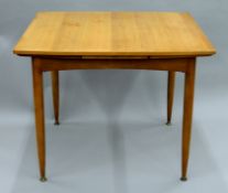 A mid-century Lebus extended dining table.