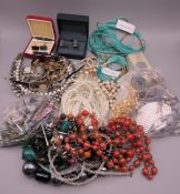 A quantity of costume jewellery and wristwatches.